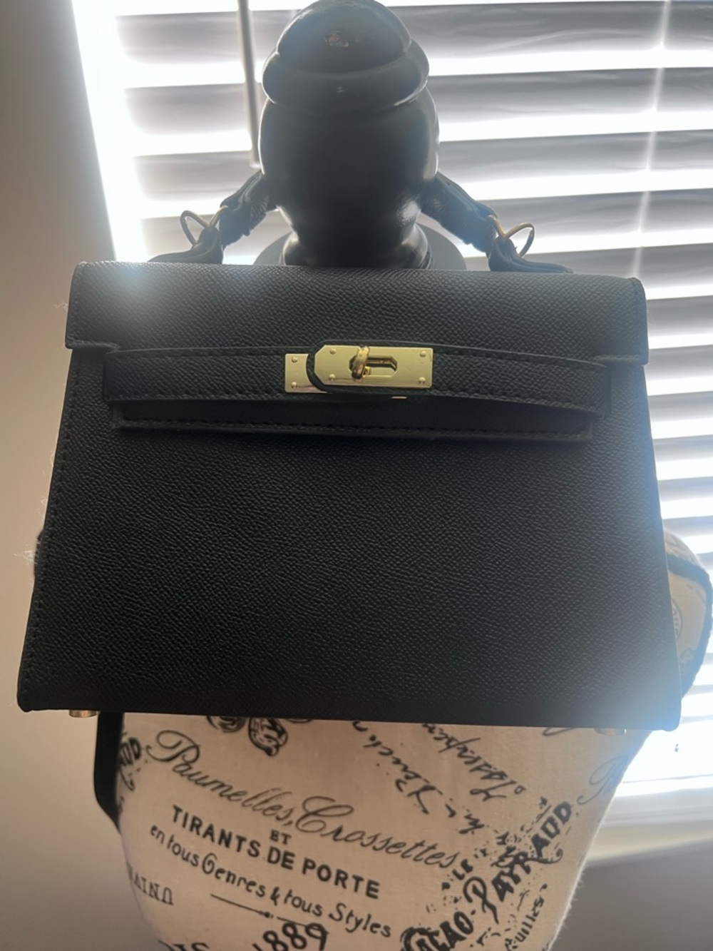No brand but inspired by  Mini Kelly 20 bag with gold hardware